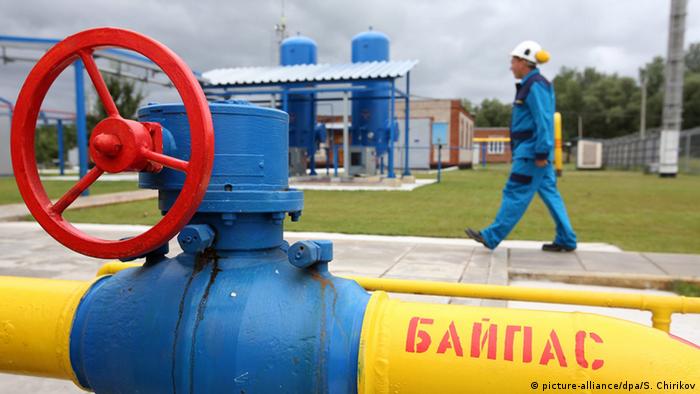 Ukrainian worker passes gas pipes at a new East Poltavske booster compressor station, in a village of Petrivka, outside Poltava, Ukraine, 27 June 2014. (Photo: EPA/SERGEI CHIRIKOV)