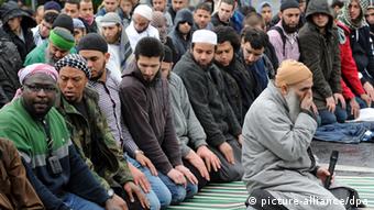 A group of Salafists sit at a gathering in Bonn in 2012