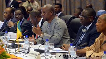 Mahama (in gray, gesturing) voiced confidence in a swift transition