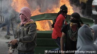 Cars burning. (Photos: AHMAD GHARABLI/AFP/Getty Images)