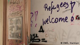Graffiti reading Refugees welcome on a Berlin door, Copyright: L. Harman