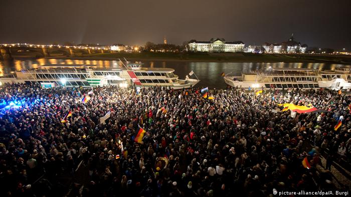 Thousands of right-wing extremists at a night-time rally on the Elbe river in Dresden.