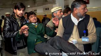 Pakistani volunteers carry a student injured in the shootout at a school under attack by Taliban gunmen, at a local hospital in Peshawar, Pakistan,Tuesday, Dec. 16, 2014
(AP Photo/Mohammad Sajjad) 