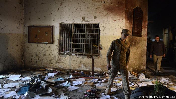 A Pakistani soldier walks amidst the debris in an army-run school a day after an attack by Taliban militants in Peshawar on December 17, 2014
(Photo: A Majeed/AFP/Getty Images)