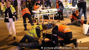 Rescue workers tending to victims after a driver deliberately slammed into passersby in several spots in Dijon