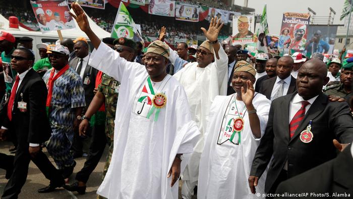 Nigeria's President Goodluck Jonathan salutes people during an election rally.