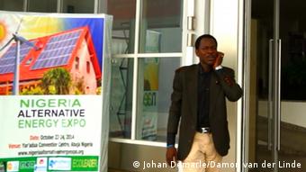 Larry Edeh Organizer of the conference on renewable energy in Abuja talking to a mobile outside the venue