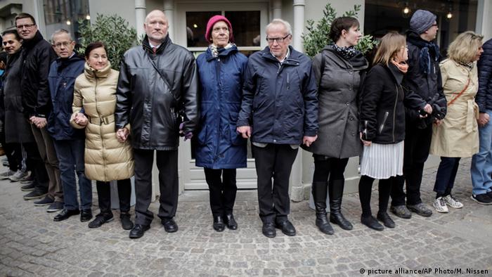 Danish people of Muslim, Jewish and Christian faith form a peace ring around the synagogue in Copenhagen, Saturday, March 14, 2015. 