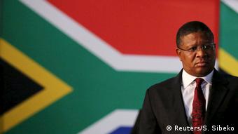 South African Sports Minister Fikile Mbalula in front of South African flag