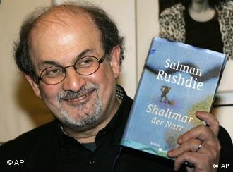 British author Salman Rushdie poses with his new book titled "Shalimar the Fool" prior to a literary meeting in Berlin on Friday, Jan. 20, 2006. (AP Photo/Fritz Reiss)