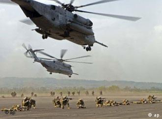In this photo released by the United States Marine Corps, U.S. Marines and sailors from Battalion Landing Team 1st Battalion, 5th Marine Regiment of the 31st Marine Expeditionary Unit, conduct a long range helicopter-borne raid at Basa Air Base, Pampanga province north of Manila, Philippines on Sunday Oct. 15, 2006. The raid was executed with the assistance from members of the Philippine Air Force as part of the annual bilateral training exercises dubbed Talon Vision and Amphibious Landing Exercise (PHIBLEX) FY 2007 which officially began Monday. (AP Photo/U.S. Marine Corps, Staff Sgt. Ricardo Morales)