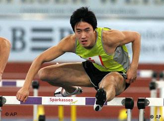 Xiang Liu from China passes the hurdle during the heat of the 60 meters hurdles competition during the Sparkassencup track and field meeting at the Hanns-Martin-Schlyer indoor arena in Stuttgart, southern Germany on Saturday, Feb. 3, 2007. (AP Photo/Daniel Maurer) 
