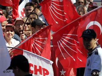 Supporters of the secular Republican People's Party or CHP wave party flags during an election rally in Sakarya, western Turkey, Thursday, July 19, 2007. The general elections in Turkey are scheduled to be held on July 22. (AP Photo/Murad Sezer)