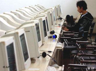 A Chinese man uses the computer at an internet cafe in Beijing Friday, Oct. 5, 2007. Reporters Without Borders, an international media rights group called on China on Wednesday to loosen controls on Internet news and personal expression, calling the country's system of censorship an insult to the spirit of online freedom. (AP Photo/Ng Han Guan)