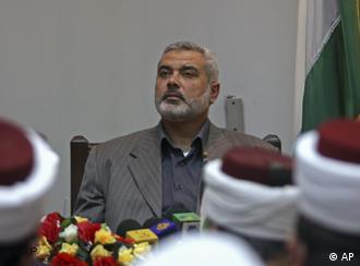 Hamas' Prime Minister Ismail Haniyeh visits a court building in Gaza City Thursday, June 5, 2008. Palestinian President Mahmoud Abbas called Wednesday for new dialogue with Hamas, in what appeared to be an about-face after insisting for a year that he would not talk with the Islamic militant movement unless it first gave up control of Gaza. (AP Photo/Khalil Hamra)