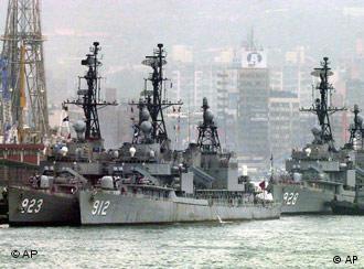 After maneuvers in the Taiwan Strait, Taiwan Navy's US-made Gearing Class frigates dock Wednesday, May 2, 2001, in Keelung harbor, 35 kilometers (21 miles) east of Taipei. Tensions remain high between the US and Beijing after last week's decision by the US to sell advanced weapons to Taiwan in the annual arms talks. (AP Photo/Wally Santana)