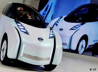Nissan Motor Co. Chief Executive Carlos Ghosn drives its Land Glider electric vehicle at the 41st Tokyo Motor Show at Makuhari Messe in Makuhari near Tokyo, Japan, Wednesday, Oct. 21, 2009. (AP Photo/Itsuo Inouye)