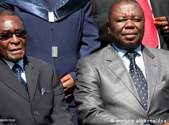 President Robert Mugabe sitting next to Prime Minister Morgan Tsvangirai