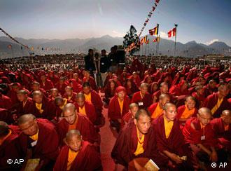 Thousands of Buddhist devotees listen to Tibetan spiritual leader the Dalai Lama during a preaching session in Tawang, in the northeastern Arunachal Pradesh state, India, Monday, Nov. 9, 2009 . Clearly uneasy about the Dalai Lama's weeklong visit to Arunachal Pradesh state, at the heart of a border dispute with neighboring China, Indian officials on Monday clamped down on journalists covering the Dalai Lama's visit. (AP Photo/Manish Swarup)