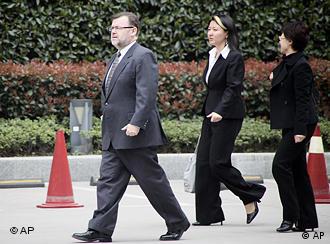 Tom Connor, Australia's Consul-General in Shanghai, left, and other officials walk to the Shanghai No. 1 People's Intermediate Court Monday, March 22, 2010 in Shanghai, China. Australian citizen Stern Hu and three other employees of mining giant Rio Tinto face trial Monday in the Shanghai court on charges of stealing business secrets and offering bribes, amid doubts over whether their prospects for a fair hearing. (AP Photo/Eugene Hoshiko)