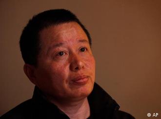 Gao Zhisheng, a human rights lawyer, pays attention to a question during his first meeting with the media since he resurfaced two weeks ago, at a tea house in Beijing, China, Wednesday, April 7, 2010. Gao, whose disappearance more than a year ago caused an international outcry, said Wednesday that he is abandoning his once prominent role as a government critic in hopes of reuniting with his family. In the meeting, Gao said he did not want to discuss his disappearance. (AP Photo/Gemunu Amarasinghe)