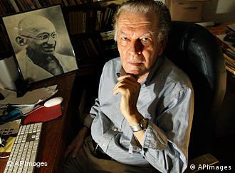 Gene Sharp sitting in his office in Boston, with a photo of Ghandi on his desk   
Copyright: AP Photo/Elise Amendola