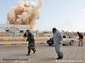 A bomb explodes in the distance in March 2011 in Libya
Photo: KHALED ELFIQI +++(c) dpa - Bildfunk+++