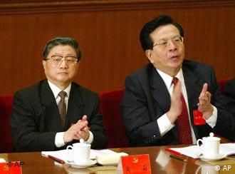 Former Shanghai Party Secretary Huang Ju, left, and Zeng Qinghong, a close aide to President Jiang Zemin, listen to Jiang's speech at the opening session of the Communist Party's 16th National Congress in Beijing's Great Hall of the People Friday, Nov. 8, 2002. Both are rumored to be contenders for senior leadership positions in the Congress under way this week. 