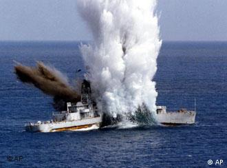 An decommissioned Taiwanese Navy ship anchored off shore explodes after a US-made MK48 torpedo hit launched by a Sea Dragon submarine during an exercise, Wednesday, Oct. 8, 2003, in Pingtung, 320 kilometers southwest of Taipei. Taiwan's armed forces often conduct exercise as China has threatened to use its massive military to force Taiwan to unify. A civil war separated the two sides in 1949. (AP Photo/Taiwan Navy, HO)